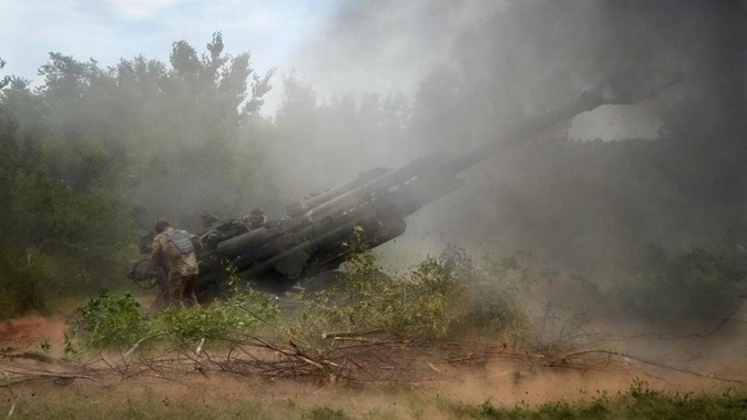 Ukrainian soldiers fire at Russian positions from a US-supplied M777 howitzer in Ukraine's eastern Donetsk region. Photo / AP