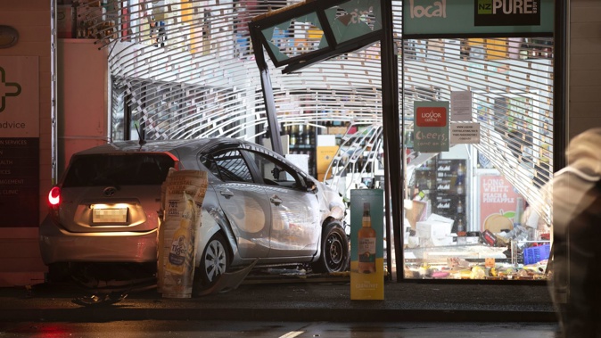 Police investigate the scene of a ram raid burglary at the Liquor Centre in Greenhithe, Auckland. Videos of ram-raid burglaries such as this one at the Liquor Centre in Greenhithe, Auckland, in May are believed to be fuelling copycat crimes. Videos of ram-raid burglaries such as this one at the Liquor Centre in Greenhithe, Auckland, in May are fuelling wannabe TikTokers. Photo / Hayden Woodward