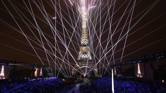 A Light Show takes place as The Olympic Rings on the Eiffel Tower are illuminated during the opening ceremony of the Olympic Games Paris 2024 at Place du Trocadero on July 26, 2024 in Paris, France. (Photo by Pascal Le Segretain/Getty Images)