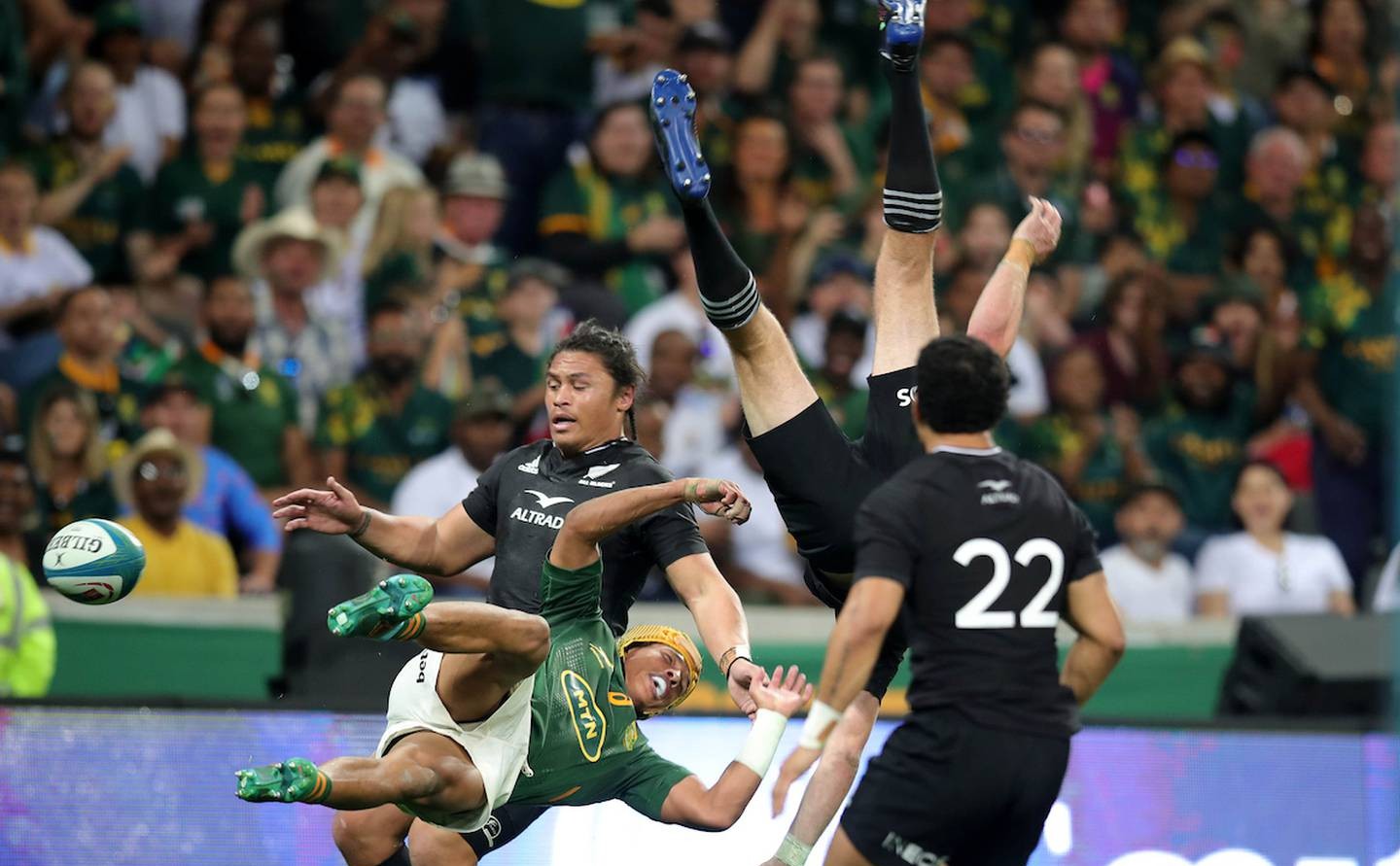 Beauden Barrett was taken out in midair by Kurt-Lee Arendse. Photo / Photosport