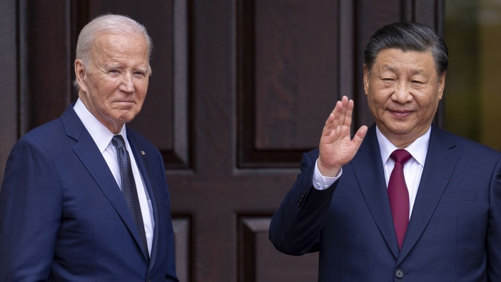 President Joe Biden greets China's President President Xi Jinping on the sidelines of the Asia-Pacific Economic Cooperative conference. Photo / AP