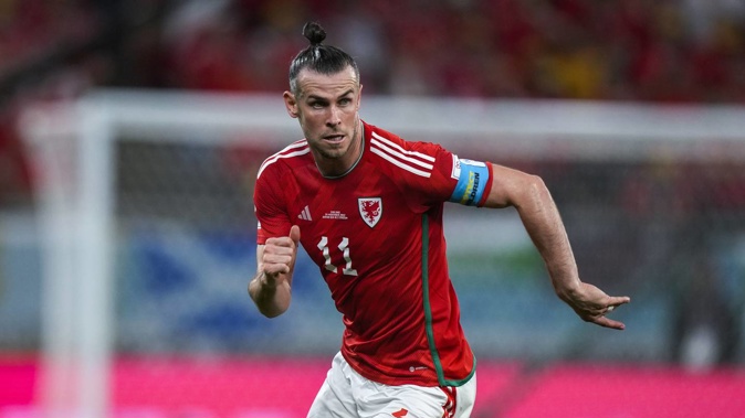 Wales' Gareth Bale runs during the World Cup group B soccer match between England and Wales. Photo / AP