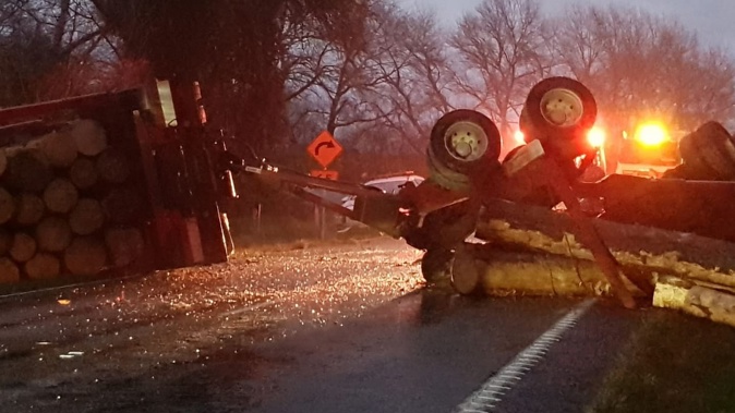 Sue Smith was on the way to work when she arrived to see the truck overturned on SH2. Photo / Sue Smith