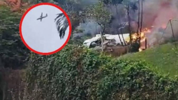 Videos shared on social media show the ATR-72 aircraft spinning out of control as it plunged down behind a cluster of trees near houses, followed by a large plume of black smoke.