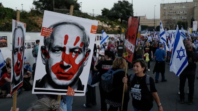 People take part in a protest against Israeli Prime Minister Benjamin Netanyahu's government and call for the release of hostages held in the Gaza Strip by the Hamas militant group outside of the Knesset, Israel's parliament, in Jerusalem on March 31. Photo / AP