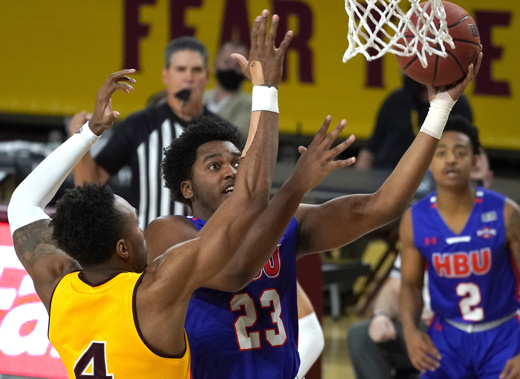 Houston Baptist guard Darius Lee (23) jumps for a layup during the first half of an NCAA college basketball game. Photo / AP