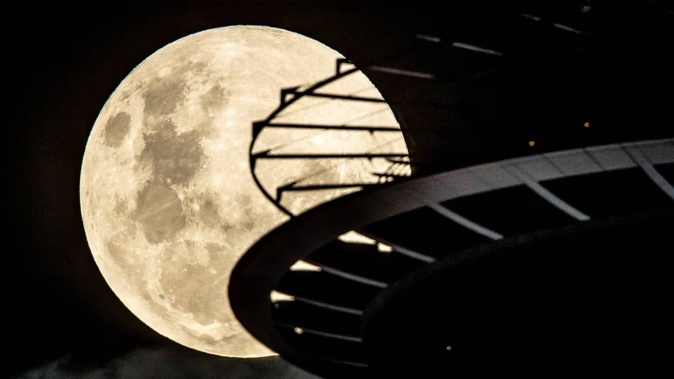 A supermoon rises over Auckland in May 2021. Two supermoon events are due this year in September and October. Photo / Michael Craig