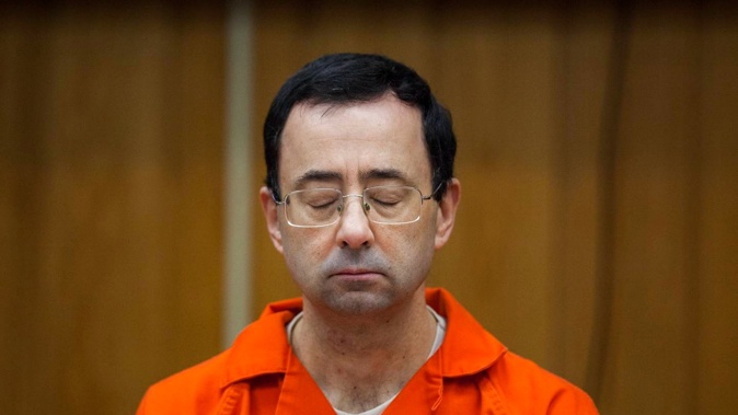 Larry Nassar listens during his sentencing in 2018. Photo / AP