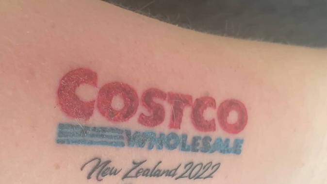 Costco superfan Jen Davenport shows off her new inked tribute to the big-box retailer which will open in New Zealand on September 28. Photo / Supplied