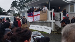 Peaceful protestors block the entrance of Whareora Hall where a Stop Co-Governance meeting hosted by Julian Batchelor was scheduled to take place. Photo / Mike Dinsdale