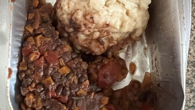 A school lunch described as "unidentifiable pasta ball and lentils".