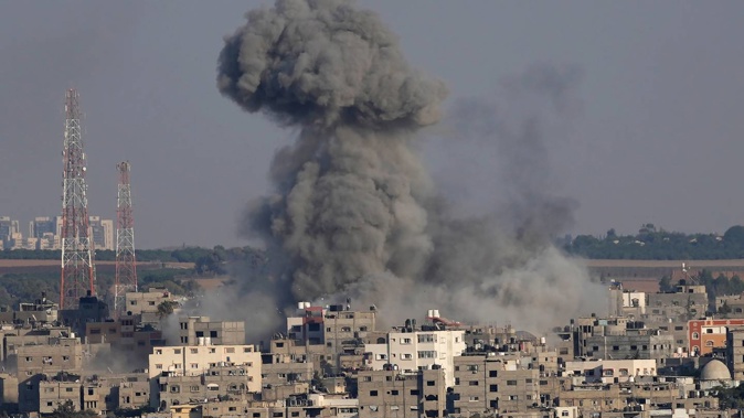 Smoke rises after Israeli airstrikes on a residential building in Gaza. Photo / Adel Hana, AP