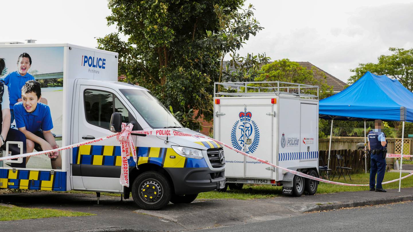 Police outside the property in Glendene where the 63-year-old man was fatally stabbed by his son. Photo / NZME