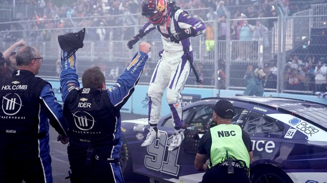 Shane van Gisbergen celebrates after winning the Nascar Cup Series race in Chicago. Photo / AP