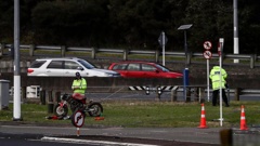 The rider died at the scene on State Highway 18 near Greenhithe. Photo / Hayden Woodward