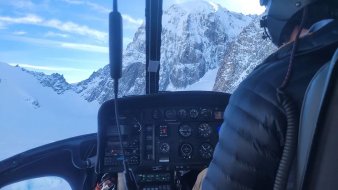 Department of Conservation staff and the Helicopter Line undertaking search and rescue operations, looking toward the South face of Mt Hicks. Photo / Department of Conservation
