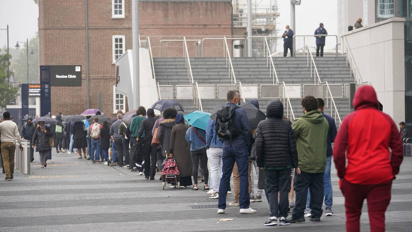 People queue at an NHS Covid vaccination clinic in north London on June 20. Photo / AP