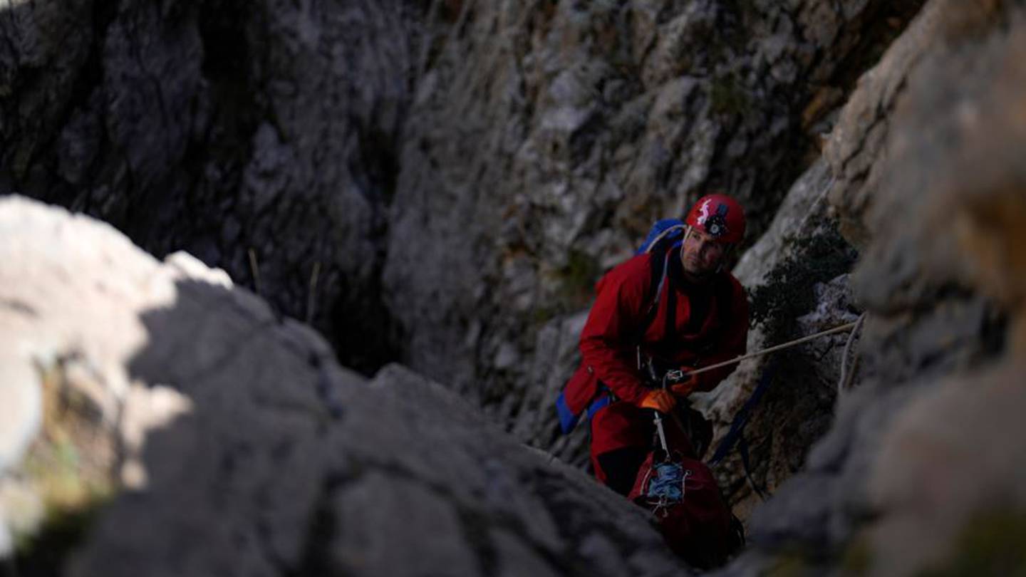 A European Cave Rescue Association (ECRA) member goes down into the Morca cave. Photo / AP