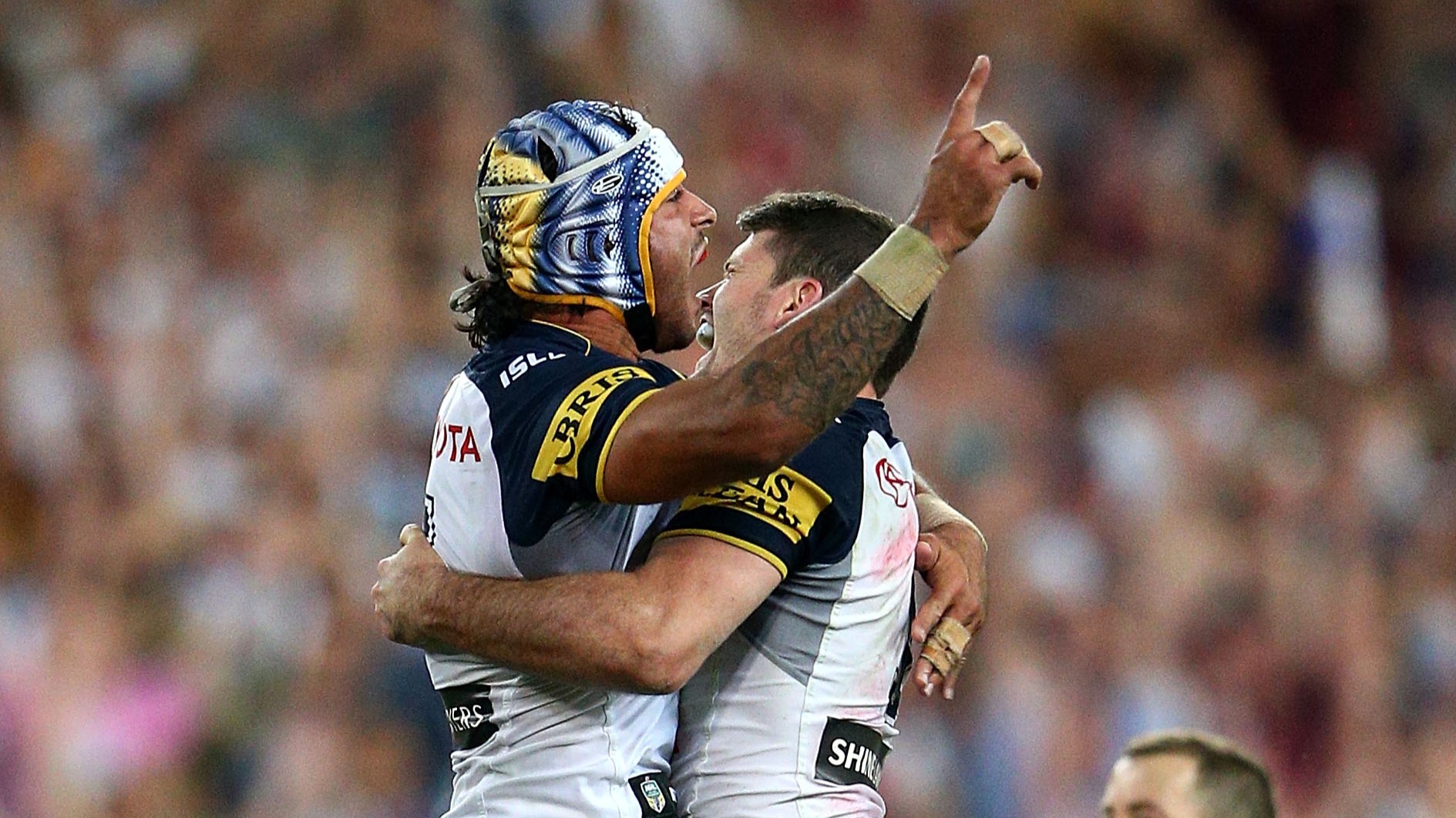 Johnathan Thurston of the Cowboys celebrates with Lachlan Coote of the Cowboys after kicking a field goal in extra-time to win the 2015 NRL Grand Final match between the Brisbane Broncos and the North Queensland Cowboys at ANZ Stadium on October 4, 2015 in Sydney, Australia. Photo / Getty