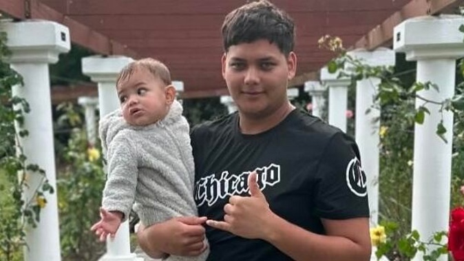 Mukzameel Ali holding baby Mustafa Maheir Mukzameel Ali, who police say died a violent death on Saturday, June 8.