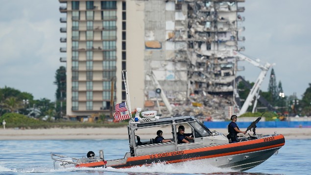 A Coast Guard boat patrols in front of the partially collapsed Champlain Towers South condo building, ahead of a planned visit to the site by President Joe Biden, on Thursday, July 1, 2021, in Surfside, Fla. Photo / AP