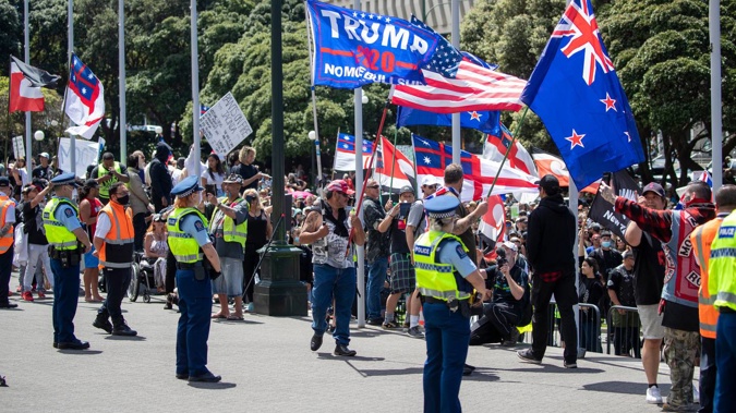 Flags for QAnon and Donald Trump could be seen flying alongside those for tino rangatiratanga and New Zealand during the 24-day occupation of Parliament grounds. Photo / Mark Mitchell