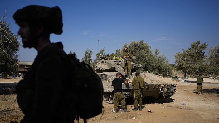 Israeli soldiers gather in a staging area near the border with Gaza Strip, in southern Israel Tuesday, Oct. 17, 2023. Photo / AP