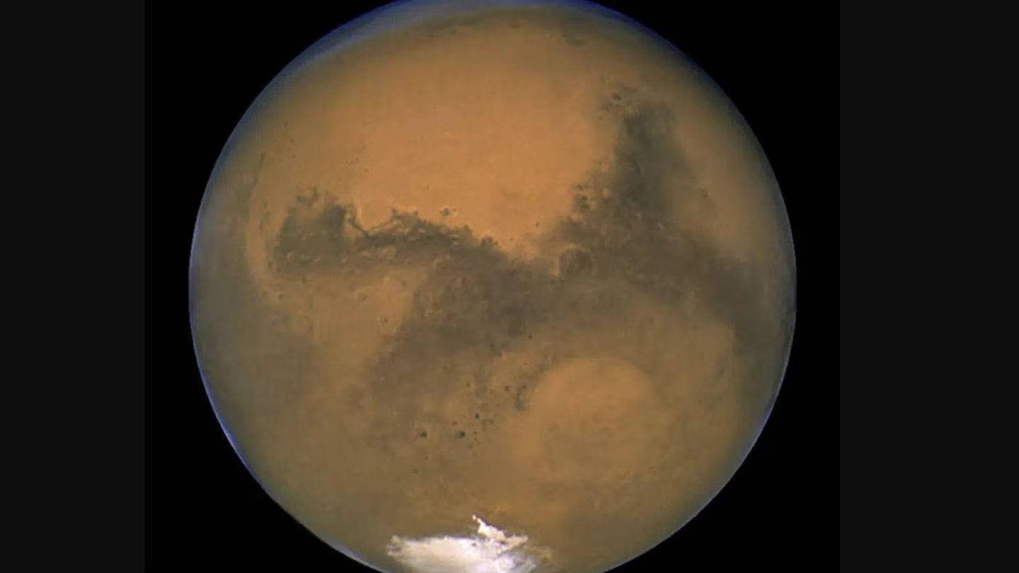 Mars, pictured as it lines up with the sun and Earth. Photo / AP