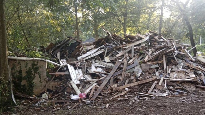 Susan Hodgson's mistakenly demolished family home sits in a pile of lumber and debris in southwest Atlanta, Georgia. Photo / AP