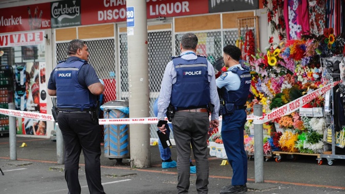 Police at the scene where an aggravated robbery has taken place a Chapel Downs Discount Liquor on Dawson Rd, Auckland. Photo / Dean Purcell