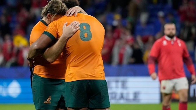Australia's Fraser McReight, left, and Australia's Rob Valetini embrace after the Rugby World Cup Pool C match between Wales and Australia. Photo / AP
