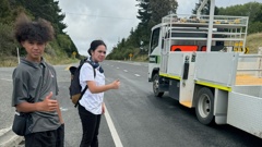 Chamon Teria Brown, 15, left, and sister Laa Jordan Brown, 16, hitchhiking to Tamatea High School from SH2 after their school bus route was terminated at the end of 2024.