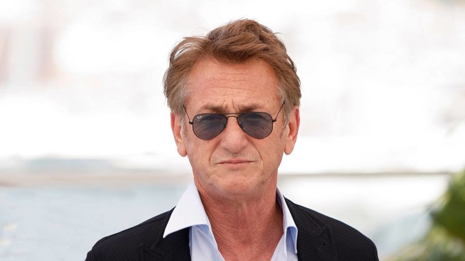 In a Twitter post Sean Penn slams Russian President Vladimir Putin and praises the way Ukranian leader Volodymyr Zelenskyy has responded to the conflict. Photo / Getty Images