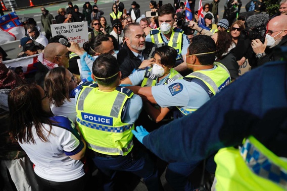 Police Officers Move In To Arrest Billy Te Kahika At Today's Protest In The Auckland CBD. (Photo / Dean Purcell)