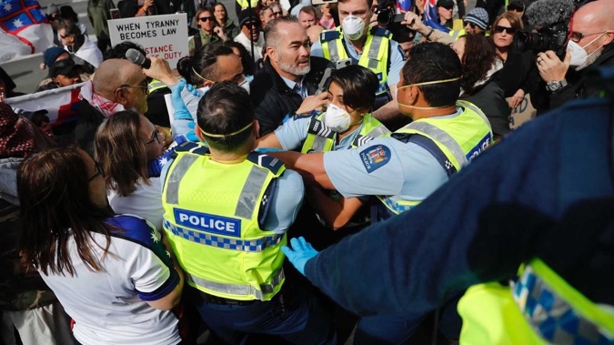 Police Officers Move In To Arrest Billy Te Kahika At Today's Protest In The Auckland CBD. (Photo / Dean Purcell)