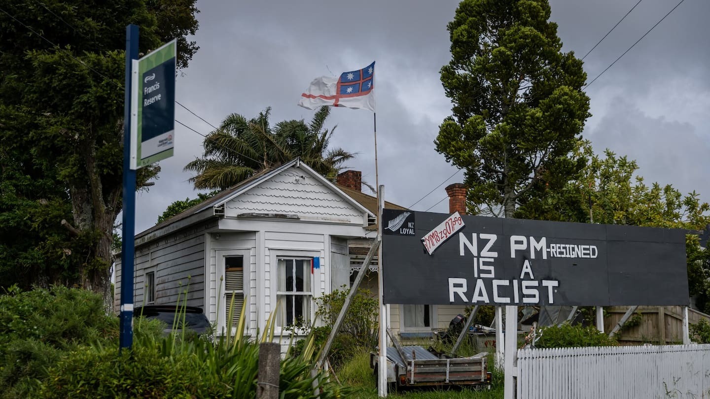 Ike Finau, whose front yard has been adorned with protest billboards for more than two decades, is at risk of losing his home over unpaid rates bills. Photo / Michael Craig