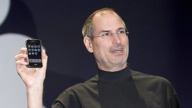 Then Apple CEO Steve Jobs reveals the first iPhone in January 2007. Photo / Getty Images