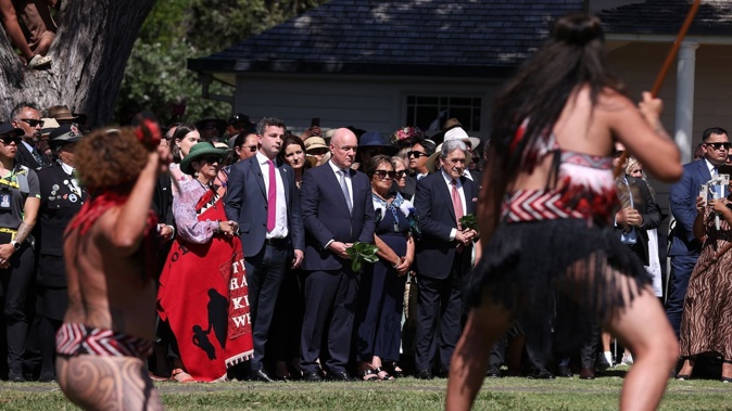 Prime Minister Christopher Luxon, flanked by ACT leader David Seymour (left) and New Zealand First leader Winston Peters (right), being welcomed onto the Treaty Grounds at Waitangi in 2024. Photo / File