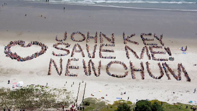 A protest in 2011 asking for John Key to save New Chum beach (NewsPixNZ/NZ Herald)