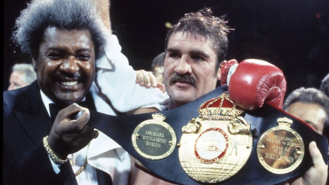 Renowned boxing promoter Don King (L) helps celebrate Gerrie Coetzee's WBF title victory in 1983. Photo / Getty