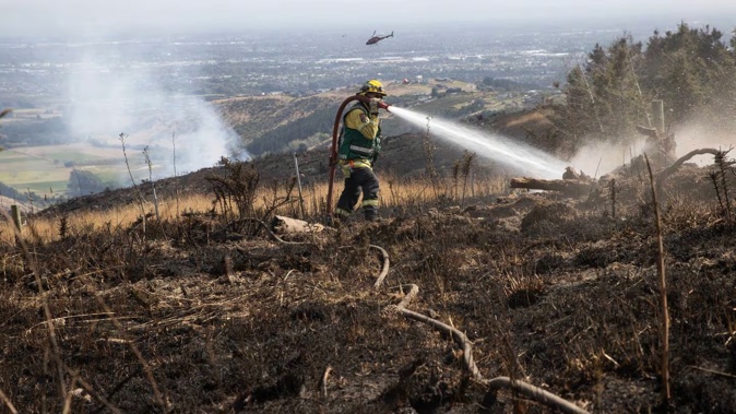 A local state of emergency remains in place as firefighters continue to battle the blaze in Christchurch's Port Hills. Photo / George Heard