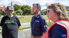Emergency Management Minister Kieran McAnulty and Tararua District Mayor Tracey Collis speaking with locals during their visit to Pōrangahau on Saturday. Photo / Mark Mitchell