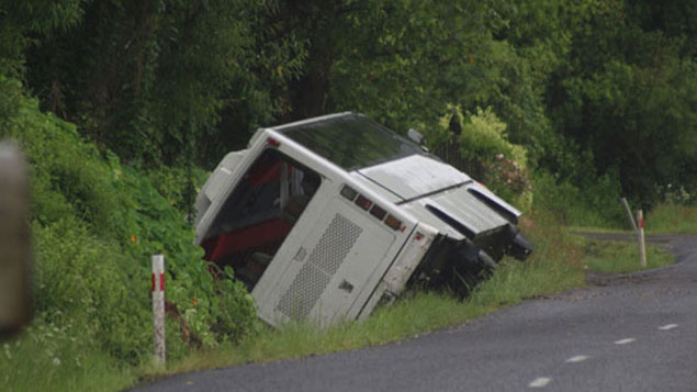 The bus carrying 50 students from Howick College rolled into a ditch near Thames. Photo: NZME./Daniel Hines