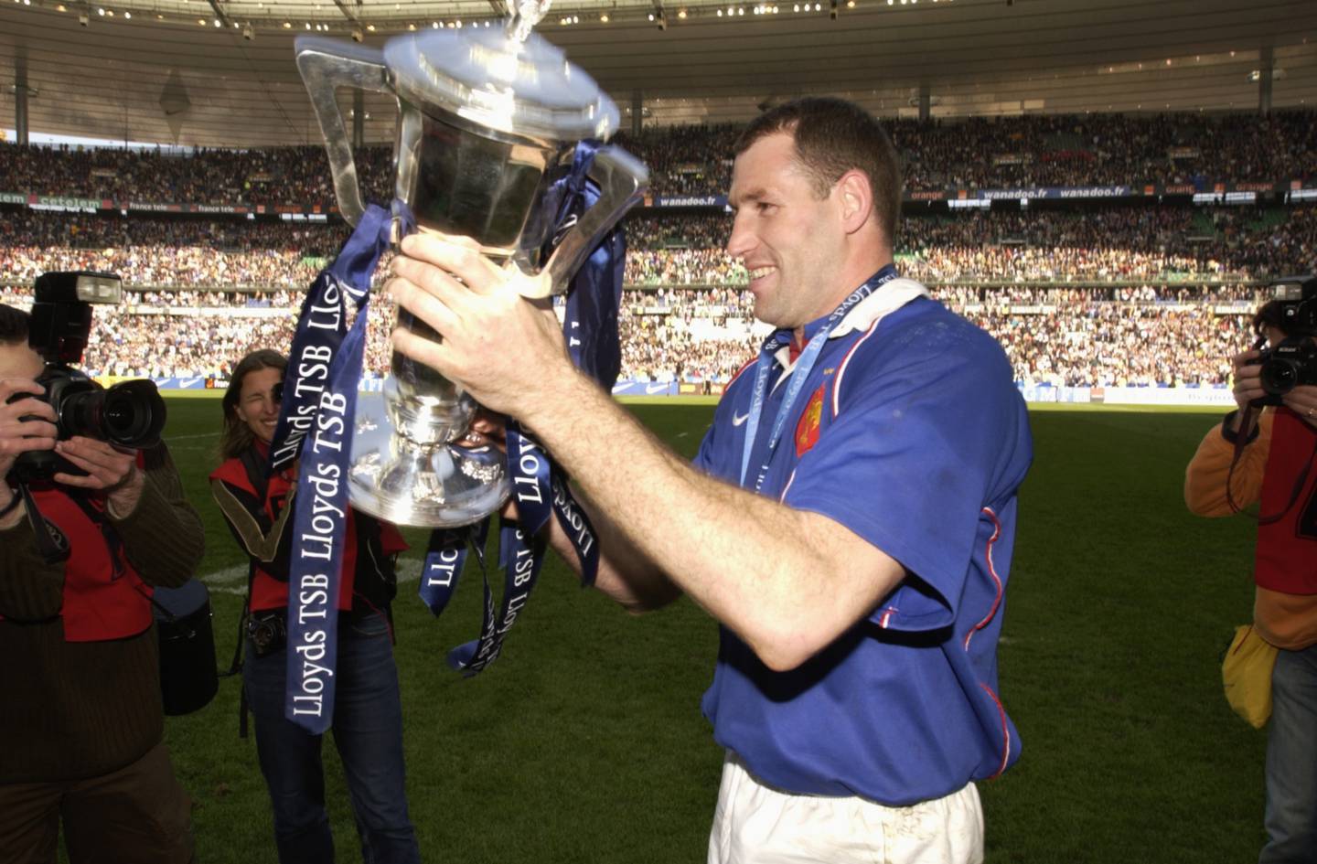 Olivier Magne of France celebrates winning the grand slam in 2002. Photo / Getty Images