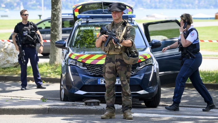 Security forces at the scene of a knife attack in Annecy in the French Alps after a man armed with a knife stabbed several young children and at least one adult. Photo / AP