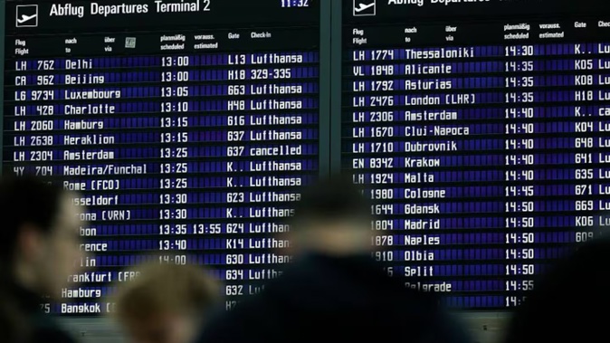 Passengers check the timetable board as flights resume at Munich Airport after temporary suspension due to drone sightings in Erding, Germany. Photo / Getty Images