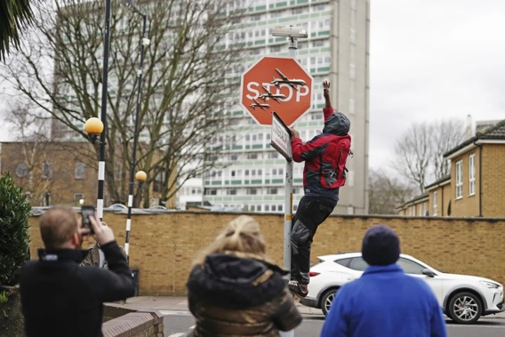 Artist Banksy's traffic stop sign was stolen shortly after it's reveal. Photo / AP