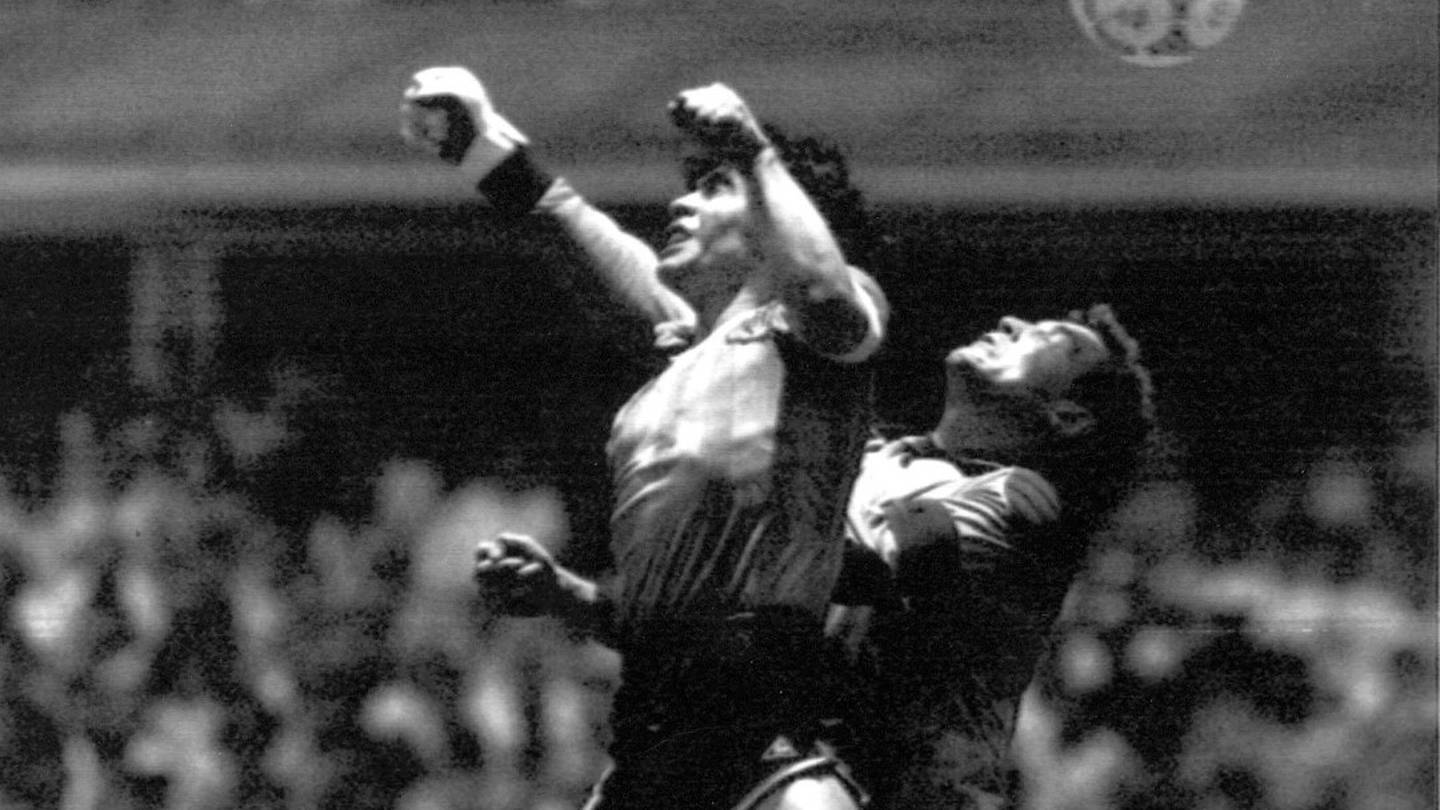 Argentina's Diego Maradona, left, beats England goalkeeper Peter Shilton to a high ball and scores his first of two goals in the famous World Cup quarter-final. Photo / AP