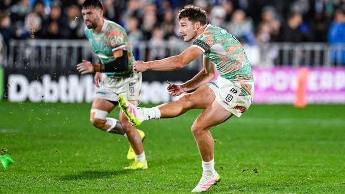 Warriors halfback Luke Metcalf watches his match-winning penalty kick against the Broncos. Photo: / Photosport