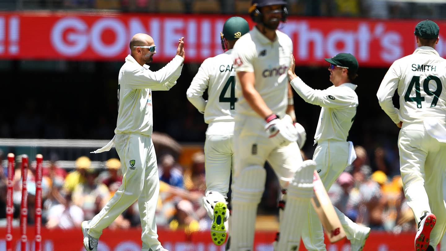 Nathan Lyon of Australia celebrates taking the wicket of Mark Wood of England. (Photo / Getty)